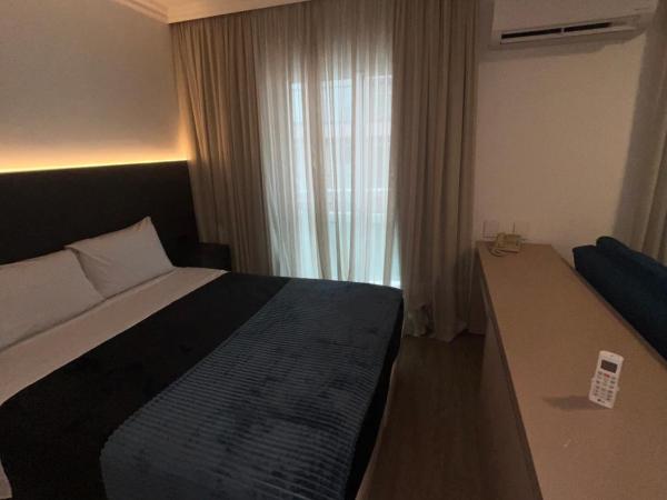 HOTEL PERDIZES - FLAT Executivo - 504 : photo 4 de la chambre chambre double deluxe (2 adultes + 1 enfant)