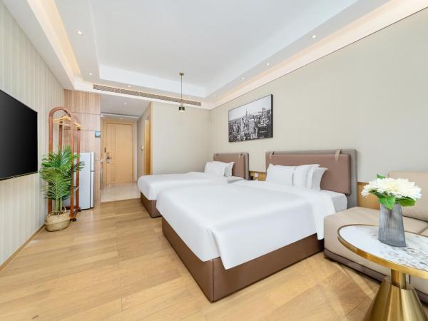 Doria Home International Apartment -Guangzhou Huijin IFC Keyun Road Metro Branch-Canton Fair Free Shuttle : photo 4 de la chambre chambre lits jumeaux deluxe