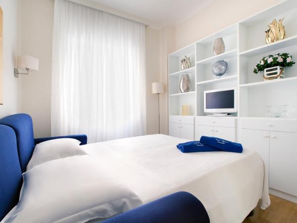 Hotel Regina : photo 3 de la chambre chambre quadruple avec jardin privé