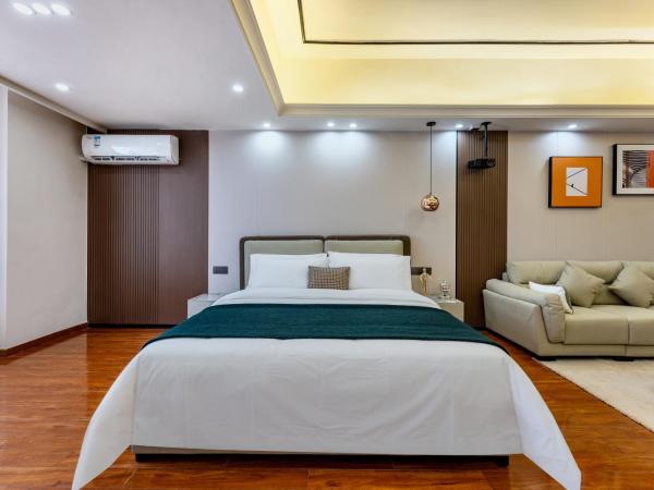 East Maple International Apartment - Guangzhou Luogang Wanda Plaza Suyuan Metro Station : photo 4 de la chambre chambre lit queen-size deluxe