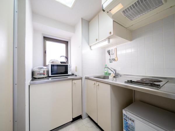 Nishinippori Guest House : photo 7 de la chambre chambre triple avec salle de bains privative