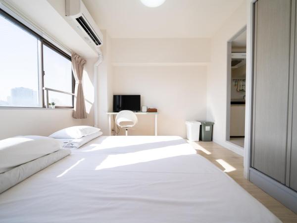 Sendagi Guest House : photo 3 de la chambre chambre triple avec baignoire