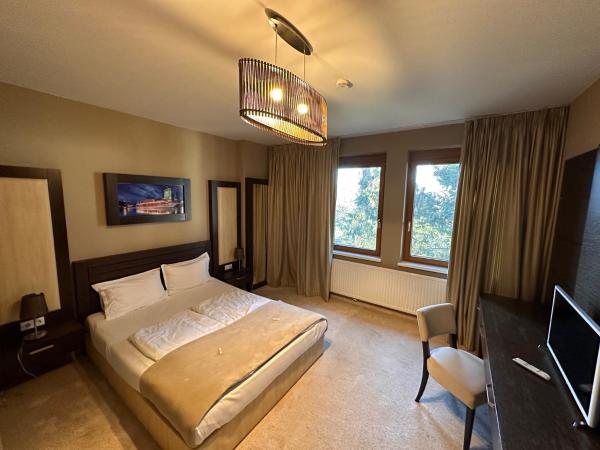 River Lodge : photo 4 de la chambre chambre lit queen-size - vue sur jardin