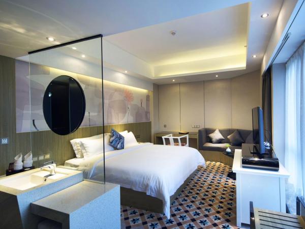 Paco Hotel Tianpingjia Metro Guangzhou - Canton Fair free shuttle bus : photo 1 de la chambre chambre supérieure lit queen-size