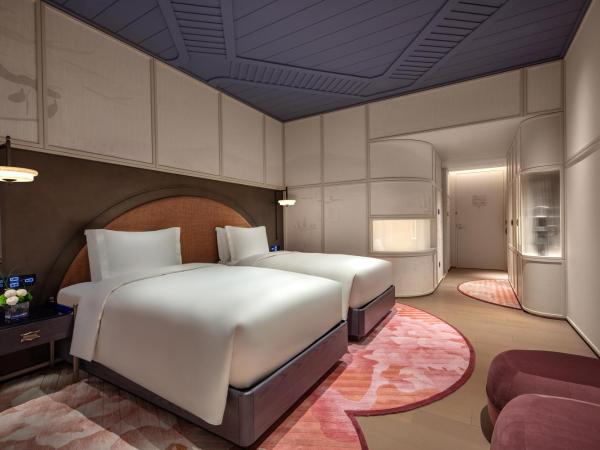 Hotel Indigo Wuxi Taihu New City : photo 3 de la chambre standard double room with two double beds and garden view