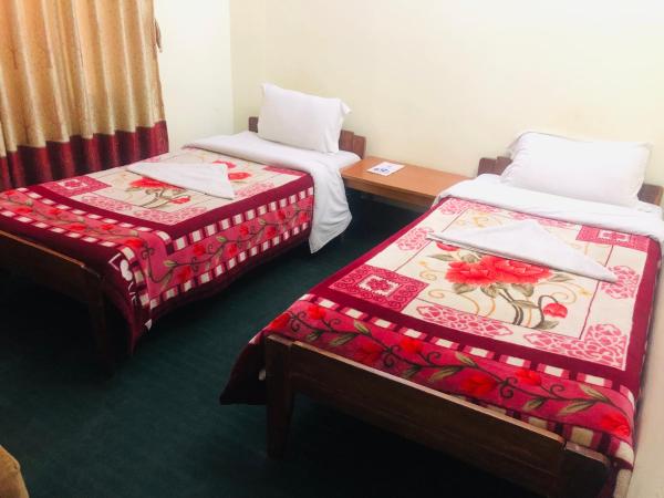 Hotel Green Orchid : photo 2 de la chambre chambre simple avec salle de bains commune