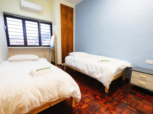 monstera guesthouse @ Ipoh Garden East : photo 2 de la chambre chambre lits jumeaux standard avec salle de bains commune