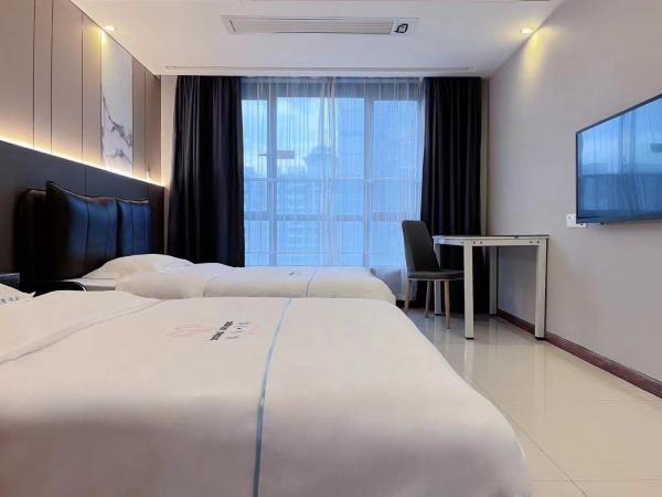 广州沃家国际公寓 : photo 1 de la chambre chambre deluxe double ou lits jumeaux