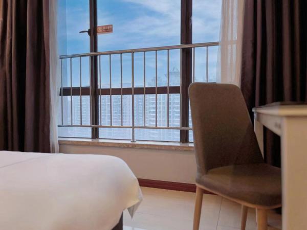 广州沃家国际公寓 : photo 4 de la chambre chambre deluxe double ou lits jumeaux