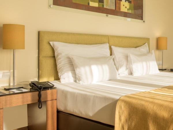 Vila Gale Coimbra : photo 2 de la chambre chambre lits jumeaux avec lit d'appoint (2 adultes + 1 enfant)