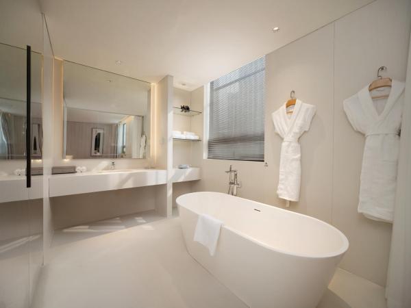 Chengdu Chengshe Hotel - Wenjiang University Town Southwest Caida Branch : photo 2 de la chambre chambre lits jumeaux exécutive avec baignoire