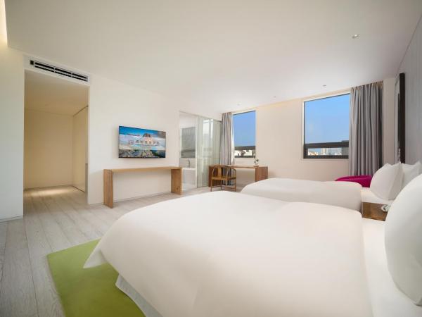 Chengdu Chengshe Hotel - Wenjiang University Town Southwest Caida Branch : photo 3 de la chambre chambre lits jumeaux exécutive avec baignoire