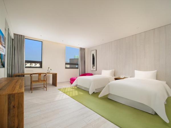 Chengdu Chengshe Hotel - Wenjiang University Town Southwest Caida Branch : photo 4 de la chambre chambre lits jumeaux exécutive avec baignoire