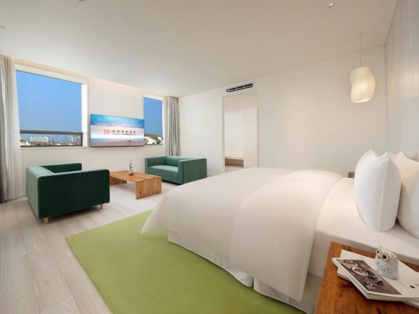 Chengdu Chengshe Hotel - Wenjiang University Town Southwest Caida Branch : photo 1 de la chambre ruogu deluxe suite with bathtub