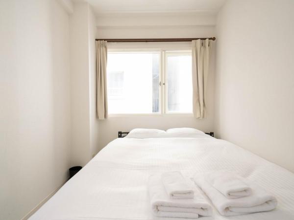 world inn Susukino : photo 1 de la chambre chambre familiale deluxe