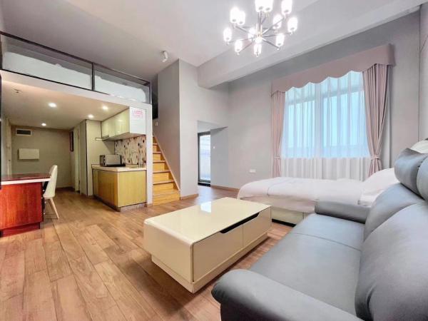 广州沃家国际公寓 : photo 1 de la chambre chambre triple avec balcon