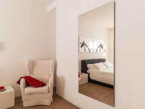 CeO LUXURY SUITE DI CAGLIARI : photo 5 de la chambre chambre lit king-size - vue sur jardin