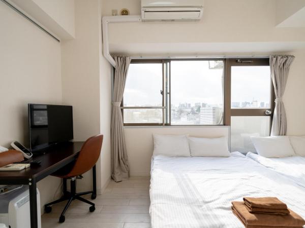 Nishinippori Guest House : photo 2 de la chambre chambre quadruple avec salle de bains privative