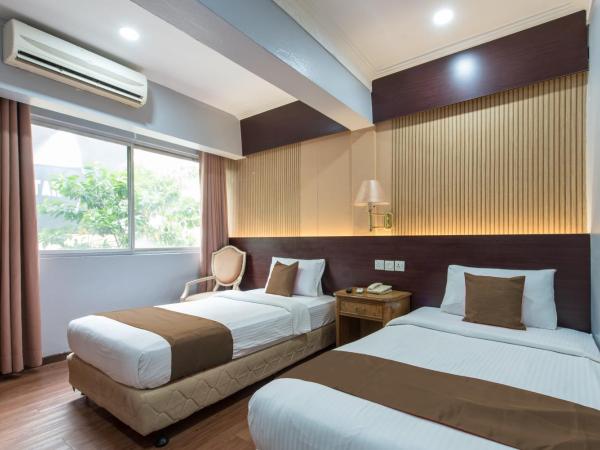 Grand Orchard Hotel Premier : photo 5 de la chambre chambre lits jumeaux deluxe