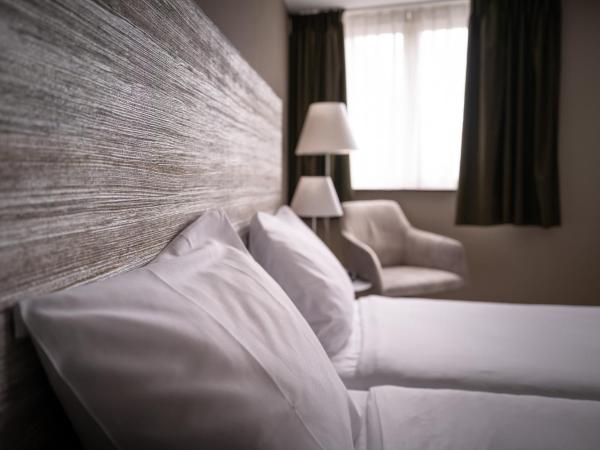 Hotel Au Quartier : photo 3 de la chambre chambre lits jumeaux