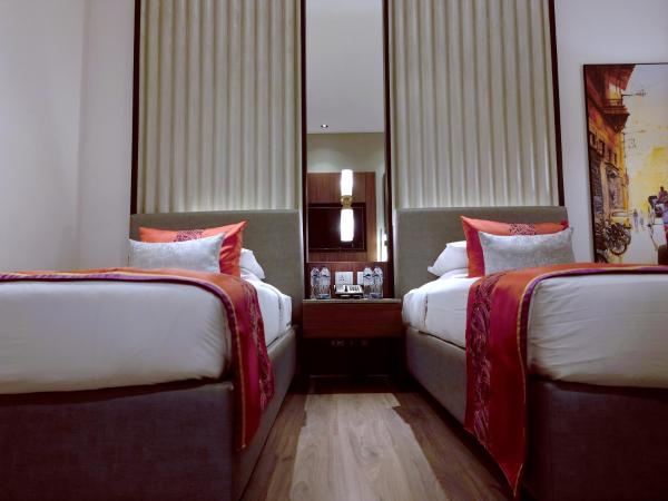 Vivanta Kolkata EM Bypass : photo 5 de la chambre chambre lits jumeaux premium - vue sur ville
