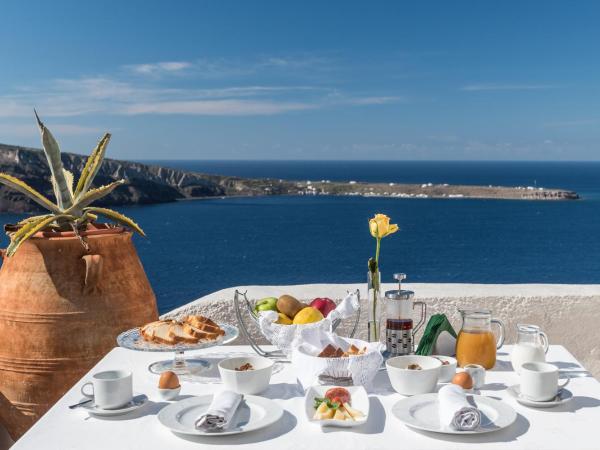 Fanari Villas : photo 10 de la chambre suite lune de miel coucher de soleil avec baignoire spa privée et vue sur la caldeira