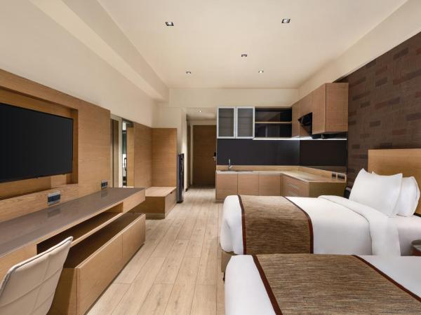 Wyndham Ahmedabad Shela : photo 4 de la chambre deluxe king or twin room with mobility access and city or garden view - non-smoking