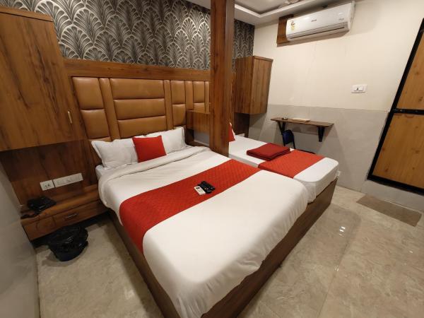 Hotel Dream Palace Residency - Near LBS Marg Kural West : photo 3 de la chambre chambre double ou lits jumeaux