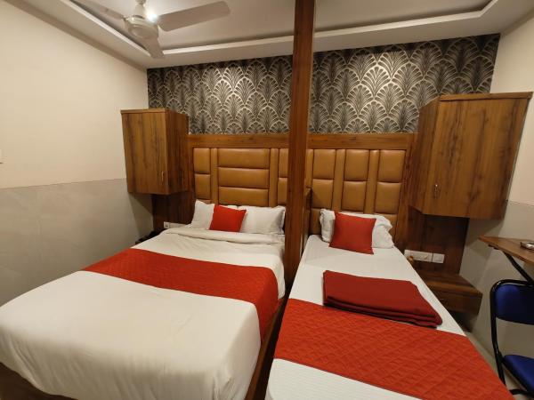 Hotel Dream Palace Residency - Near LBS Marg Kural West : photo 4 de la chambre chambre double ou lits jumeaux