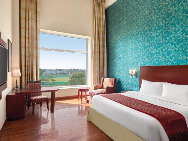 Ramada by Wyndham Jaipur Jaisinghpura : photo 3 de la chambre premium king room (non smoking)