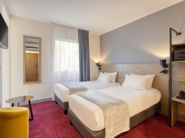 Sure Hotel by Best Western Les Portes de Montauban : photo 2 de la chambre chambre lit king-size supérieure avec lit simple