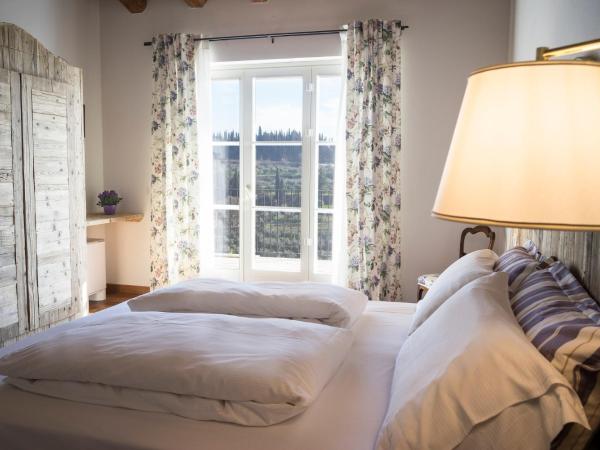 La Vineria di San Mattia : photo 1 de la chambre chambre double ou lits jumeaux deluxe – vue sur jardin