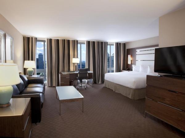 Hôtel Le Cantlie Suites : photo 3 de la chambre suite junior avec lit king-size et canapé-lit