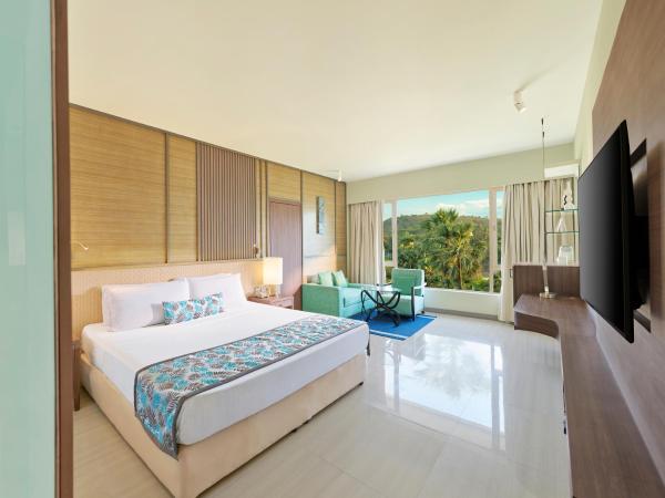 The Resort : photo 1 de la chambre hébergement de luxe - vue sur jardin