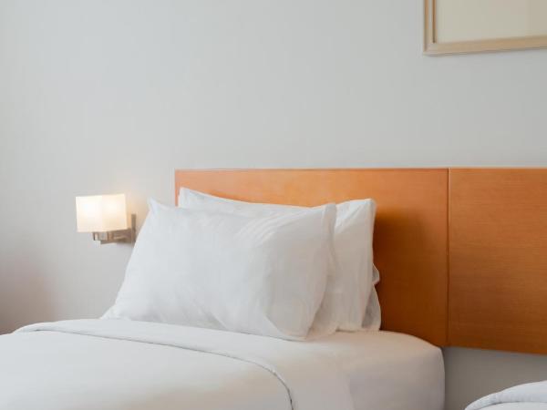 The Capital Hotel Surabaya : photo 7 de la chambre chambre lits jumeaux deluxe