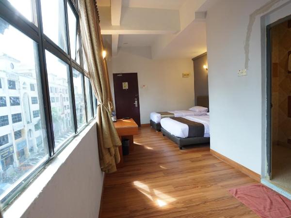 Zen Zeng Hotel : photo 3 de la chambre chambre triple deluxe