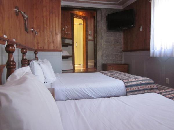 Hôtel Manoir de l'Esplanade : photo 1 de la chambre suite de luxe avec 2 lits queen-size