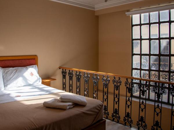 Suites Sevilla : photo 2 de la chambre chambre quadruple en duplex