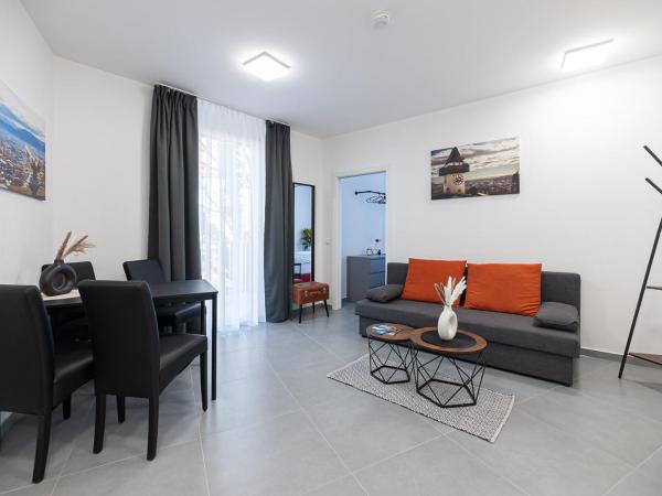 Grazora Living Apartments : photo 6 de la chambre suite supérieure lit king-size