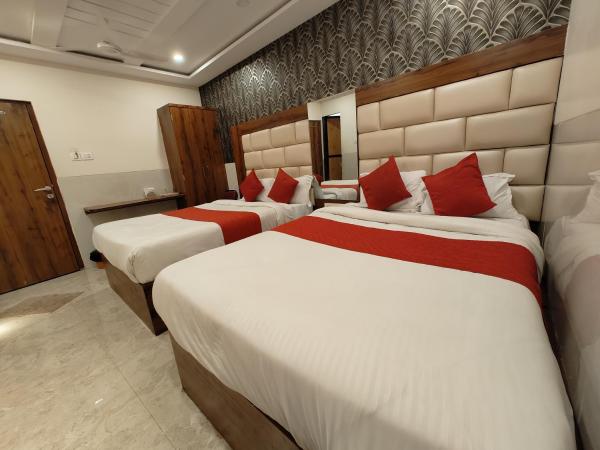 Hotel Dream Palace Residency - Near LBS Marg Kural West : photo 3 de la chambre chambre quadruple