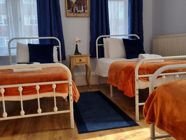 The Windmill Hotel : photo 1 de la chambre chambre triple