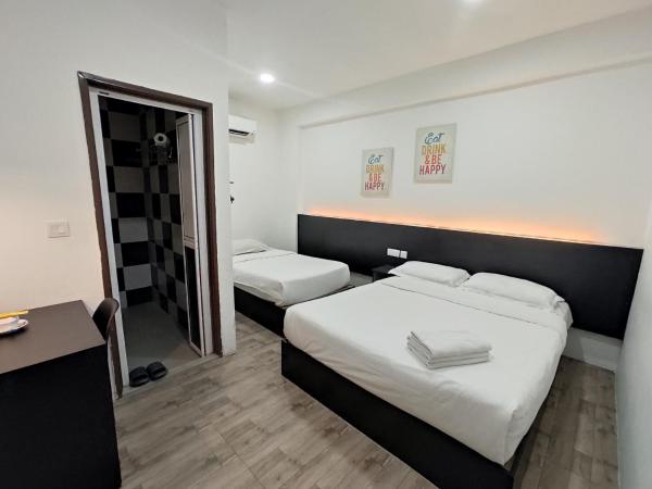 Tambun Warm Hotel : photo 6 de la chambre chambre triple