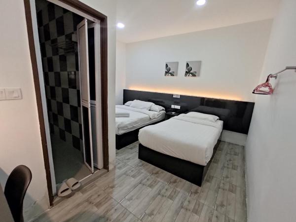 Tambun Warm Hotel : photo 7 de la chambre chambre triple