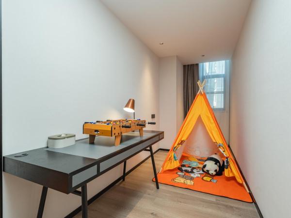 广州琶洲会展中心亚朵酒店-广交会期间免费穿梭巴士 : photo 1 de la chambre chambre familiale jimu