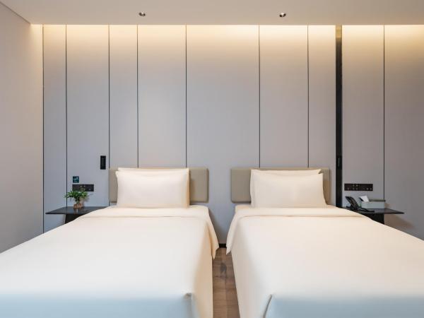 广州琶洲会展中心亚朵酒店-广交会期间免费穿梭巴士 : photo 1 de la chambre chambre lits jumeaux exécutive