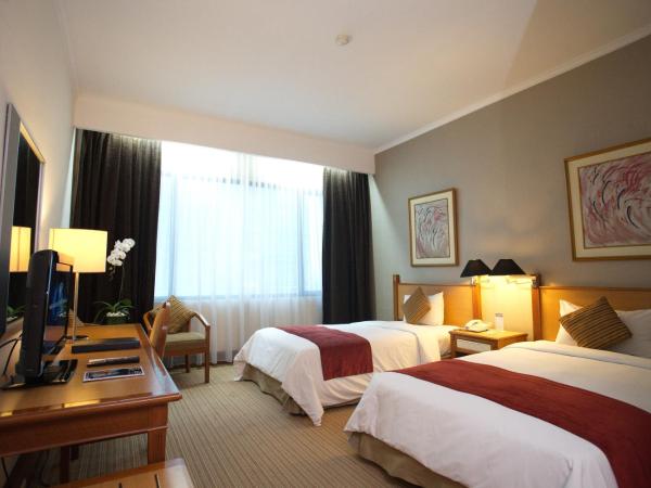 Menara Peninsula Hotel : photo 1 de la chambre chambre lits jumeaux deluxe