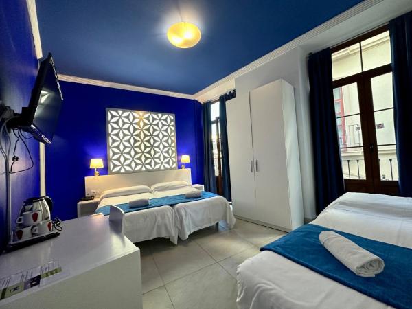 Nest Style Granada : photo 3 de la chambre chambre triple