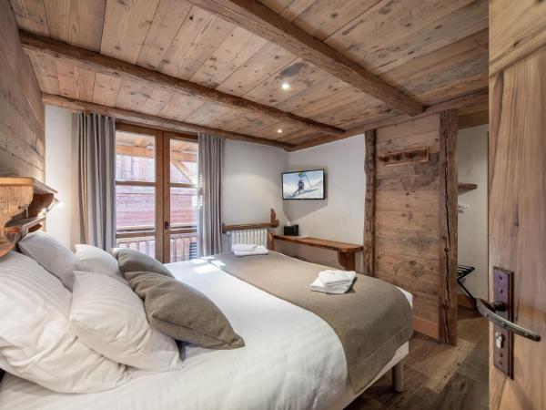 Chalet K120 - Village du Praz - Courchevel : photo 2 de la chambre chambre double ou lits jumeaux avec terrasse