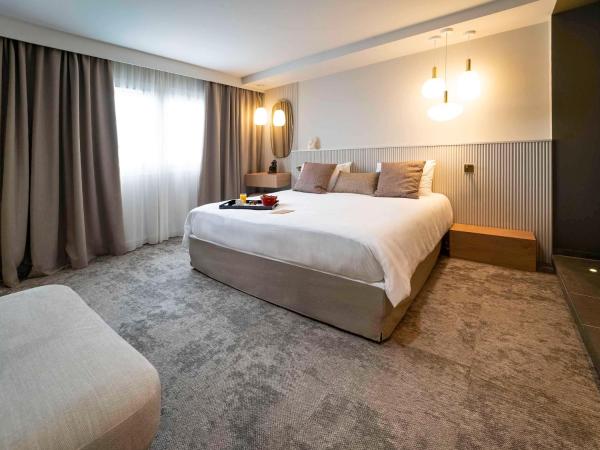 Mercure Bordeaux Lac : photo 4 de la chambre whirlpool king suite with sofa bed and garden view