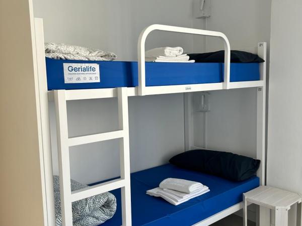 Albergue SCQ : photo 2 de la chambre lit dans dortoir mixte de 4 lits